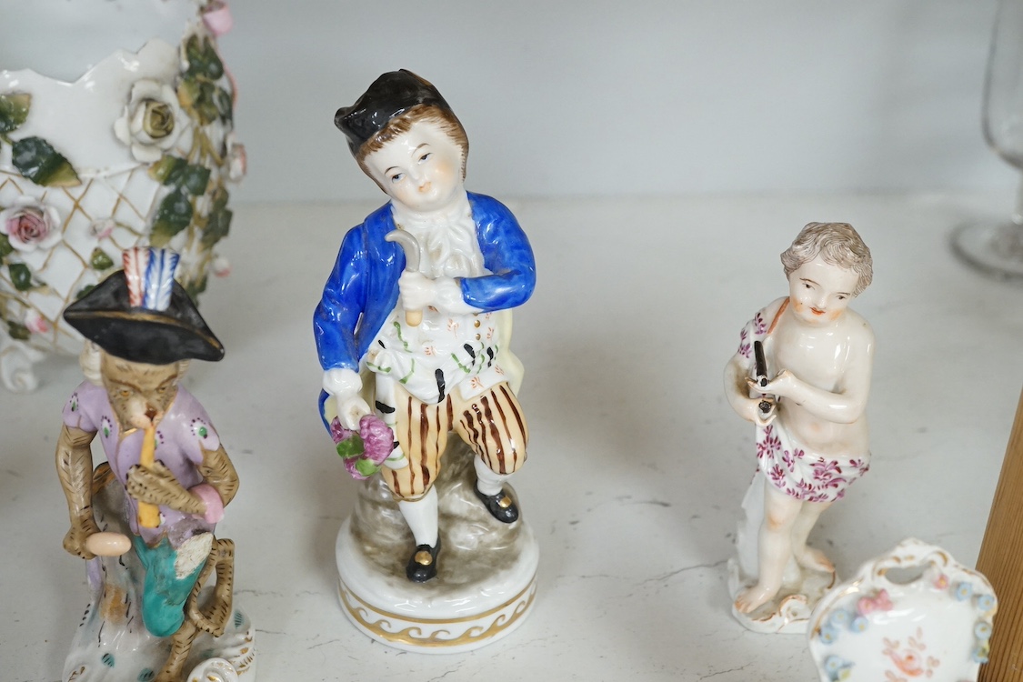 A nine piece German porcelain monkey band, a Meissen figure of a cherub together with other 19th century and later porcelain, largest 15cm high. Condition - varies